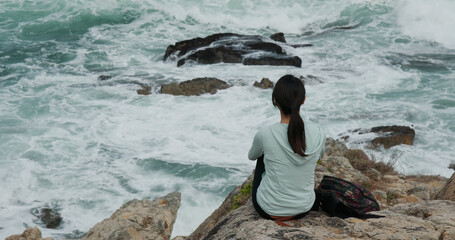 Woman look at the sea wave