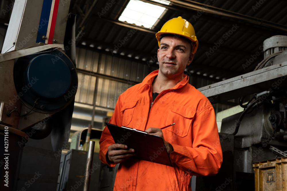 Poster skillful factory worker working with clipboard to do job procedure checklist . factory production li