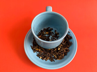 dried tea leaves in a cup.