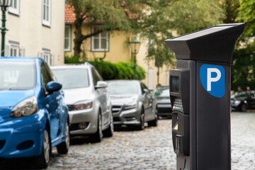 Fototapeta premium Parking machine with solar panel in the city street. Pay On Foot Parking System 