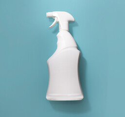 White bottle with a spray bottle on a blue background with a shadow. design. mockup for logo, ad, organic detergent product, white background. Top View, Flat Lay. copy space 