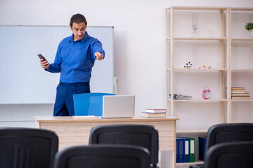 Fototapeta premium Young male business trainer making presentation during pandemic