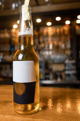 a bottle of beer on the bar desk