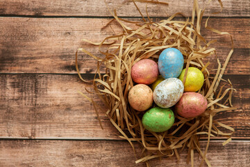 Colorful easter eggs on wooden background. . Happy Easter background.