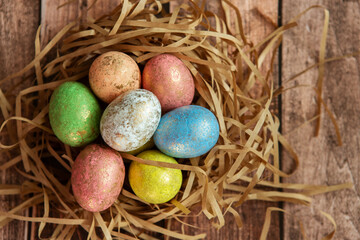 Colorful easter eggs on wooden background. . Happy Easter background.