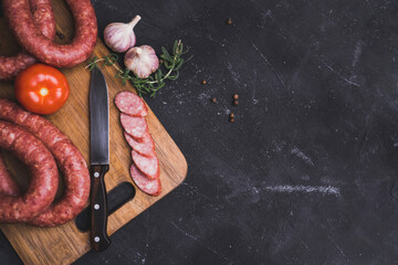 Homemade sausage on a cutting board. View from above