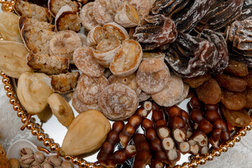 Dried fruits and berries laid out on a plate