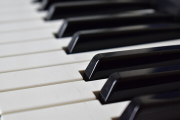Fototapeta na wymiar black-and-white fragment of synthesizer keys close-up