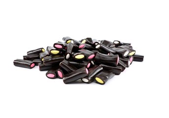 Licorice candy sticks with colorful fillings on white background.