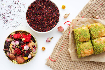 oriental sweets. traditional Turkish baklava with pistachios and pomegranate tea