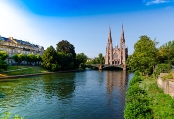 Fototapeta na wymiar A nice view on The St. Paul's Church of Strasbourg, France. It is located on the point where the Ill and Aare rivers join. Beautiful sunny summer day.