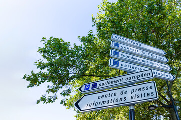 Strasbourg, France, August 2019. Information road signs for the European parliament, visitor center and press. Beautiful summer day.