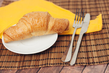 croissant in a plate on the table kitchenware breakfast meal 