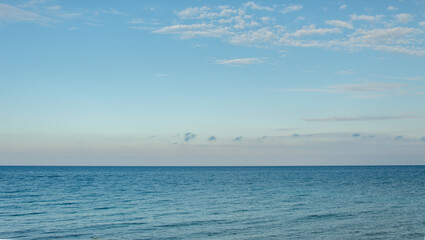 Obraz premium Sea and sky in beautiful blue colors. Summer concept with a lot of space for text.