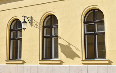 Fototapeta na wymiar Windows of the old city hall building