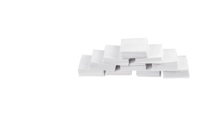 Patches for cleaning weapons isolate on a white background. White square scraps of fabric stacked in piles.