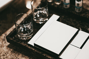 White empty boxes in a hotel bathroom. Modern interior in marble in brown tones