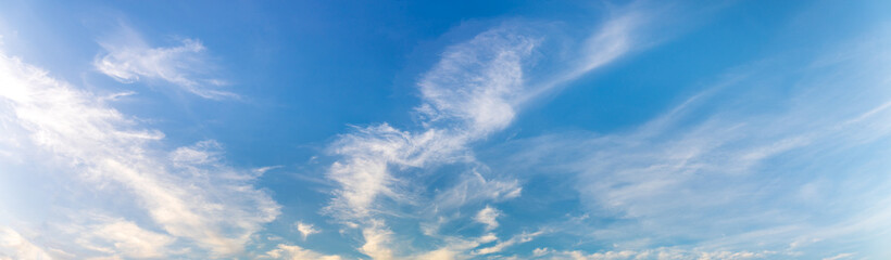 Fototapeta premium Panorama or panoramic photo of blue sky and white clouds or cloudscape. for breathing concepts background.
