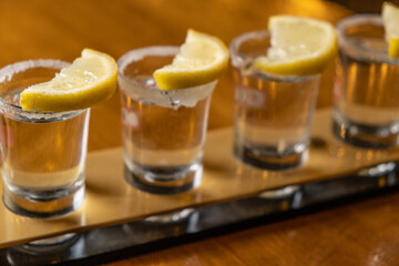 tequila lined up on bar desk