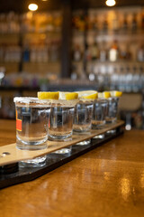 tequila lined up on bar desk