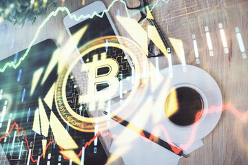 Double exposure of blockchain theme hologram over table with phone. Top view. Crypto technology...