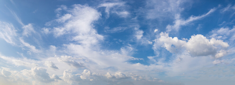 Panorama or panoramic photo of blue sky and white clouds or cloudscape. for breathing concepts background.