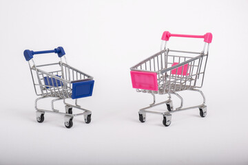 Two toy Shopping Carts on white backgrounds.
