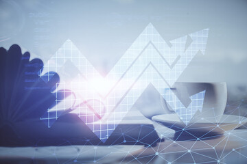 Double exposure of arrows drawing and desktop with coffee and items on table background. Concept of growth.