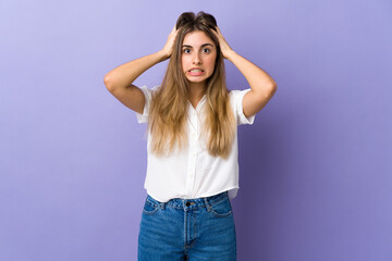 Young woman over isolated purple background doing nervous gesture