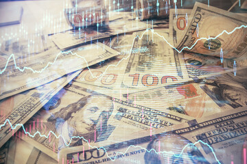 Multi exposure of forex chart drawing over us dollars bill background. Concept of financial success markets.