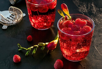 Sweet raspberry vodka cocktail with ice. Refreshing summer drink