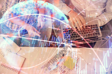 Multi exposure of man and woman working together and forex graph hologram drawing. Financial analysis concept. Computer background. Top View.