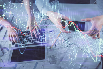Multi exposure of man and woman working together and forex graph hologram drawing. Financial analysis concept. Computer background. Top View.