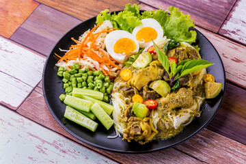 Rice noodles with chicken green curry Thai cuisine