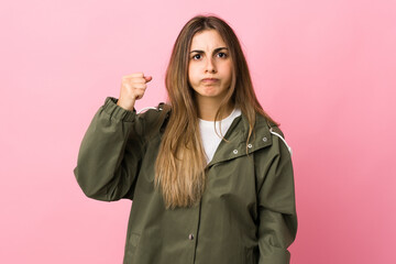 Young woman over isolated pink background with unhappy expression