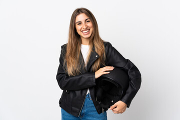 Young Woman holding a motorcycle helmet over isolated white background laughing