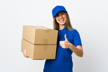 Young delivery woman over isolated white background giving a thumbs up gesture