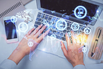 Double exposure of woman hands working on computer and forex graph hologram drawing. Top View. Financial analysis concept.