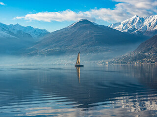 Sailboat on Lake Como at morning hours