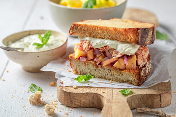 Homemade sandwich with chicken, mango and yoghurt sauce.
