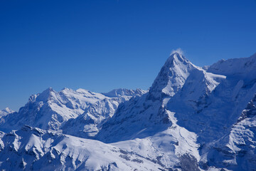 Fototapeta na wymiar Panorama of Bernese Alps with Mountain Peak Eiger, seen from Mürren, Switzerland.
