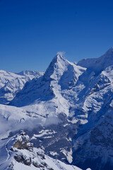 Fototapeta na wymiar Panorama of Bernese Alps with Mountain Peak Eiger, seen from Mürren, Switzerland.