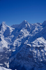Panorama of Bernese Alps with Mountain Peaks Eiger and Mönch (monk), seen from Mürren, Switzerland.