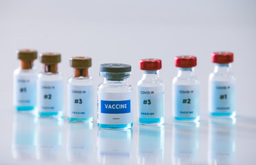 Covid 19 vaccine bottles medical background