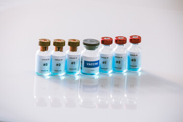 Covid 19 vaccine bottles medical background