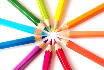 Naklejka premium White background with colored pencils. Rounded frame