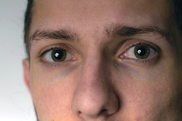 Close up of a male hand on a old fashioned central heating thermostat