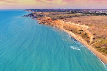 Seascape with sea and city on the clay steep coast. Aerial view towards Fontanka, Odesa, Ukraine