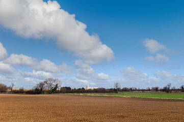 View overlooking ploughed fiields and ancient Minster in spring. Beverley, UK.