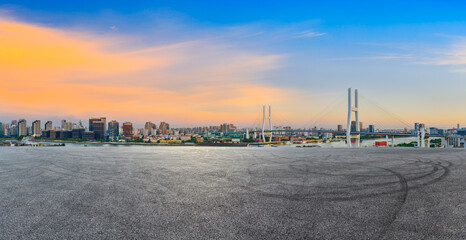 Race track road and city skyline with buildings at sunset in Shanghai,China.